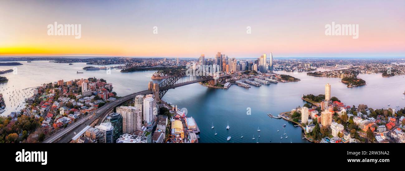 Wide aerial panorama of Sydney harbour aroudn major city architecture landmarks. Stock Photo