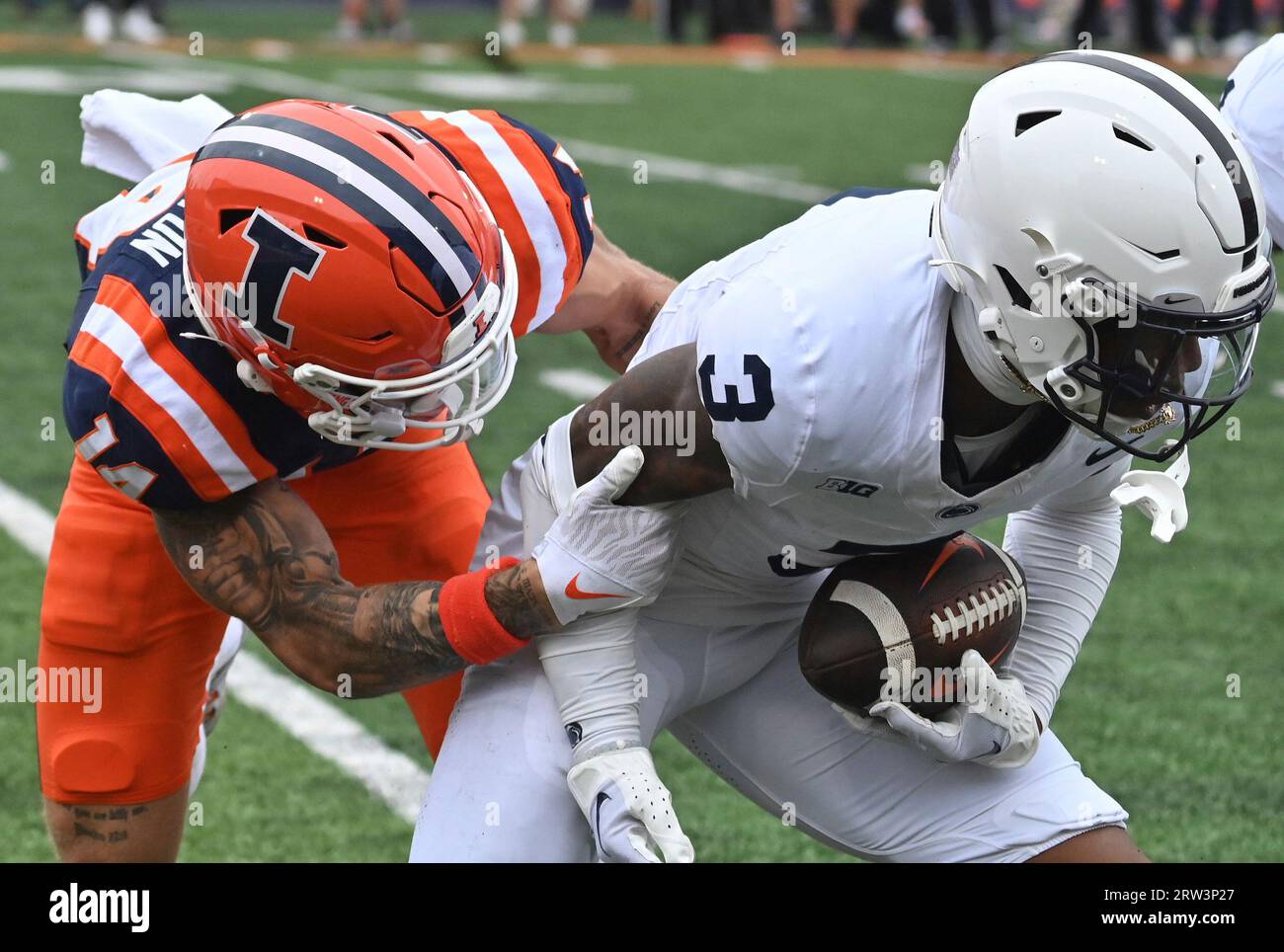 CHAMPAIGN, IL SEPTEMBER 16 Illinois wide receiver Casey Washington (14) tackles Penn State
