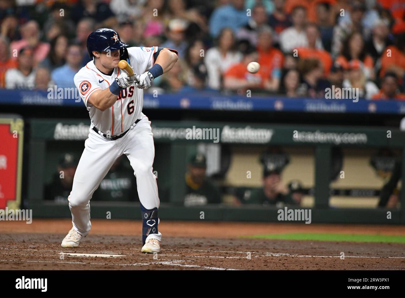 Houston Astros center fielder Jake Meyers (6) drops a perfect bunt for a single in the bottom of the fourth inning of the MLB game between the Oakland Stock Photo