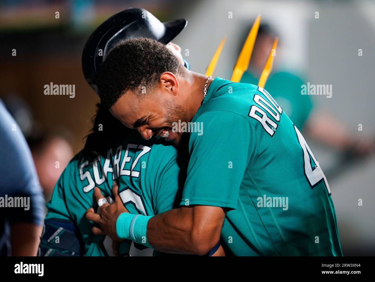 Seattle Mariners' Eugenio Suarez holds a trident while celebrating his home  run with Julio Rodriguez, right, in a baseball game against the Los Angeles  Angels, Tuesday, Sept. 12, 2023, in Seattle. (AP