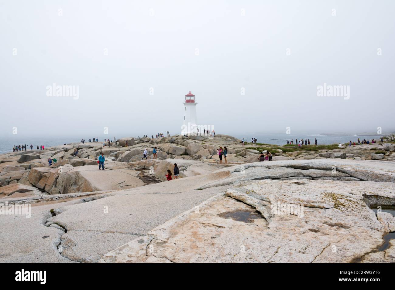 Peggy's Cove, Canada August 13, 2015people near the Peggy's Cove lighthouse in Nova Scotia