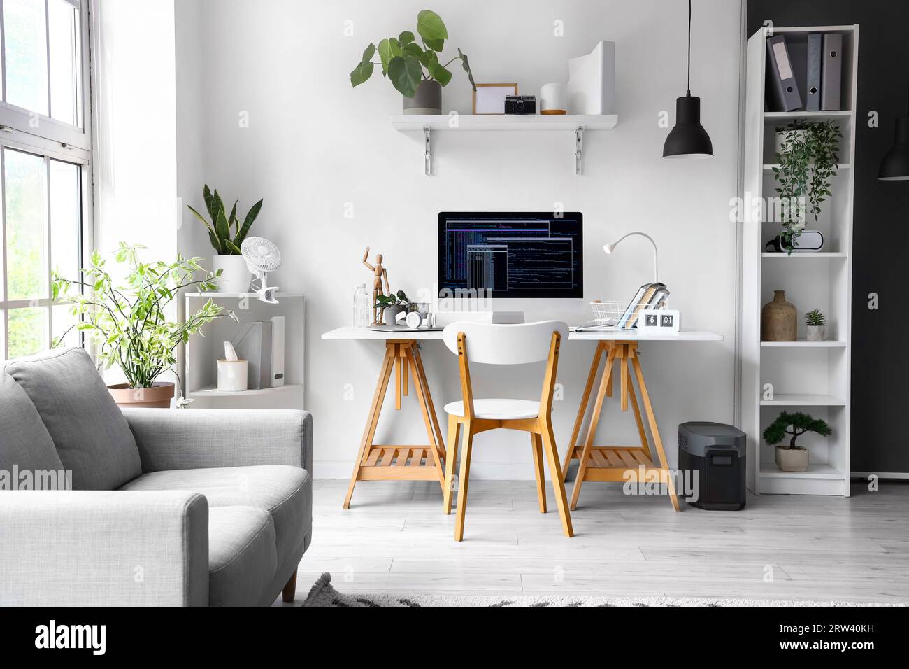 Interior of office with programmer's workplace and sofa Stock Photo - Alamy