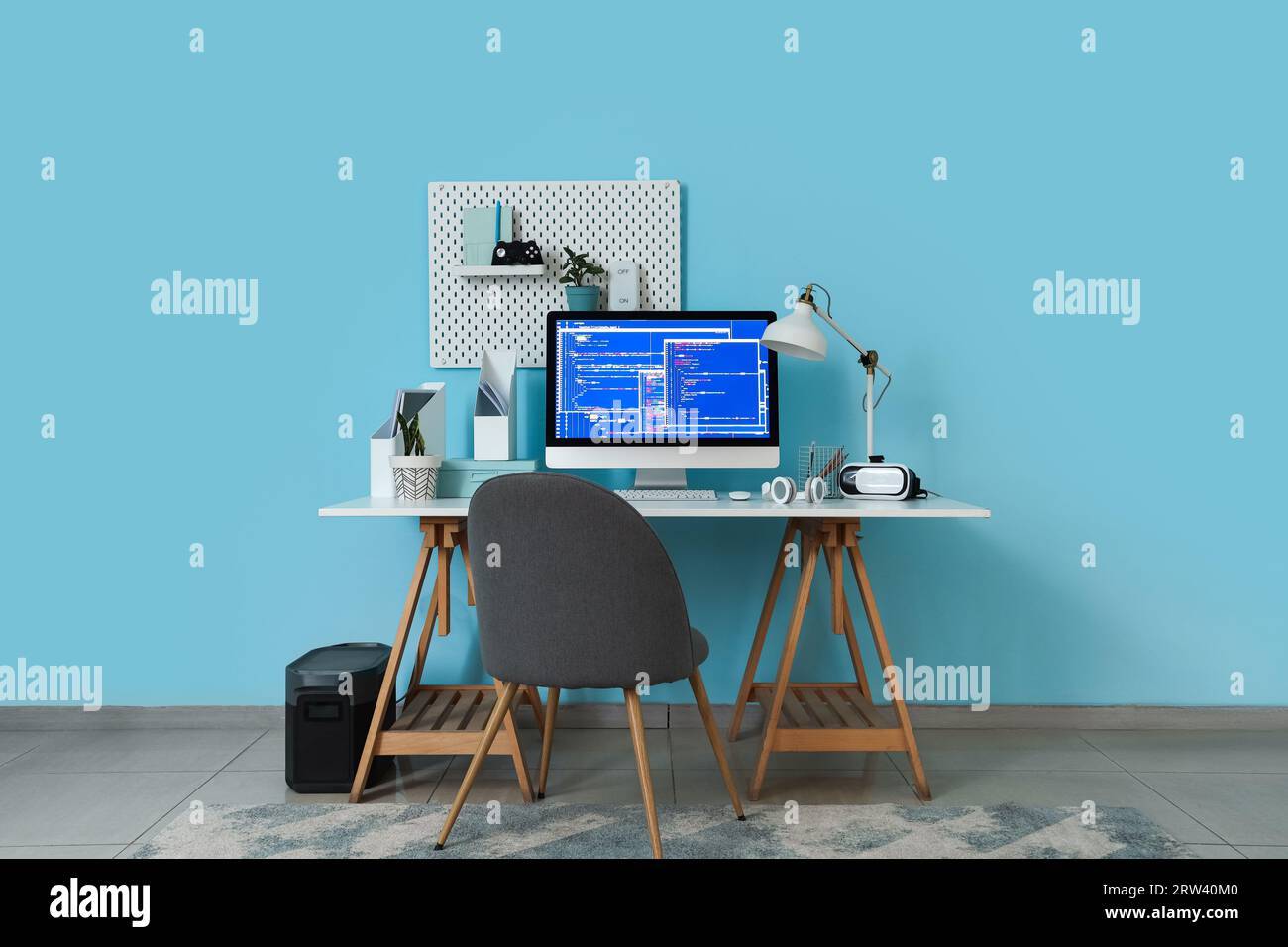 Interior of office with programmer's workplace and pegboard Stock Photo ...