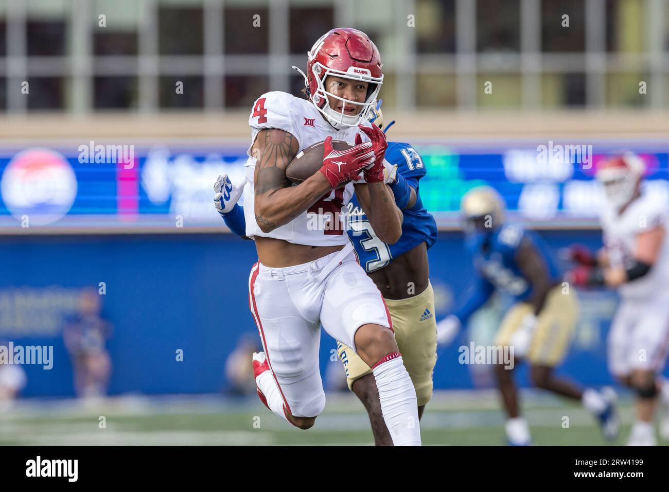 Oklahoma Wide Receiver Nic Anderson (4) Carries Past Tulsa Cornerback ...