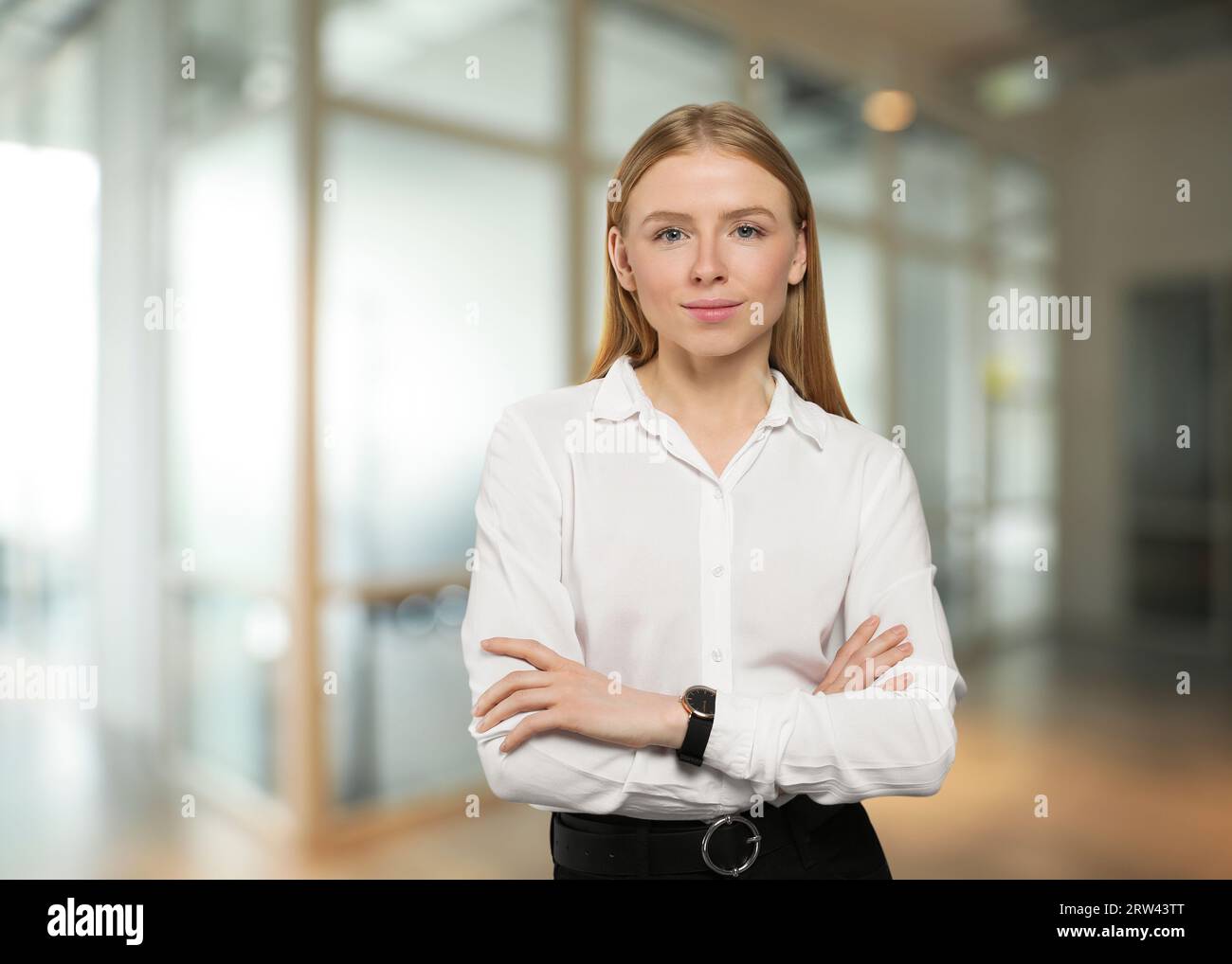 Portrait of confident woman in office. Pretty girl on blurred background Stock Photo