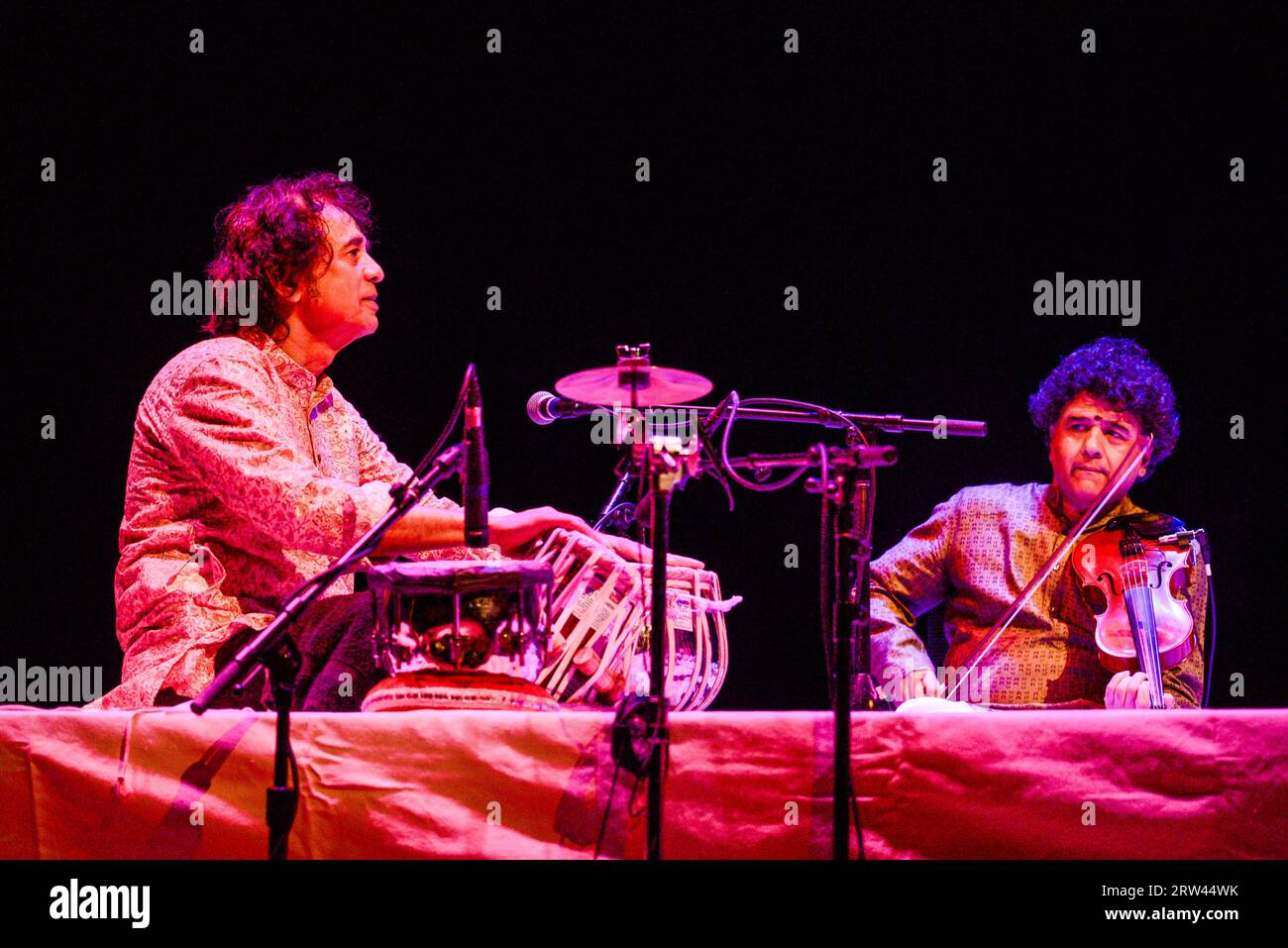 Zakir Hussein, Ganesh Rajagopalan of Shakti perform at Arlene Schnitzer Concert Hall in Portland, Oregon, USA on 5 September 5, 2023. Photo ©Anthony P Stock Photo