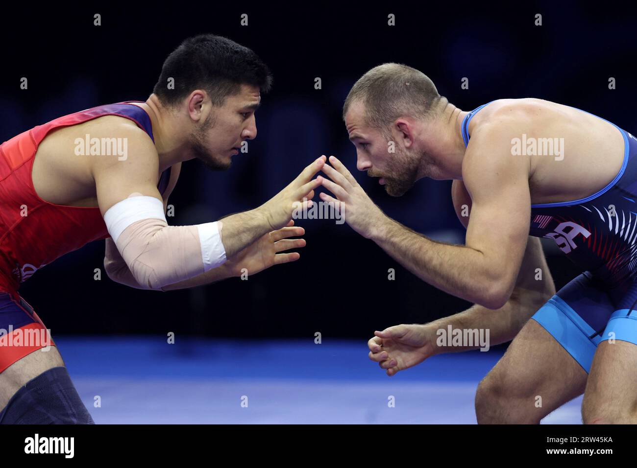 David Morris Taylor of Unites States of America (blue) and Azamat Dauletbekov of Kazakhstan compete during the mens freestyle 86 kg semi-final match at the Wrestling World Championships in Belgrade, Serbia on
