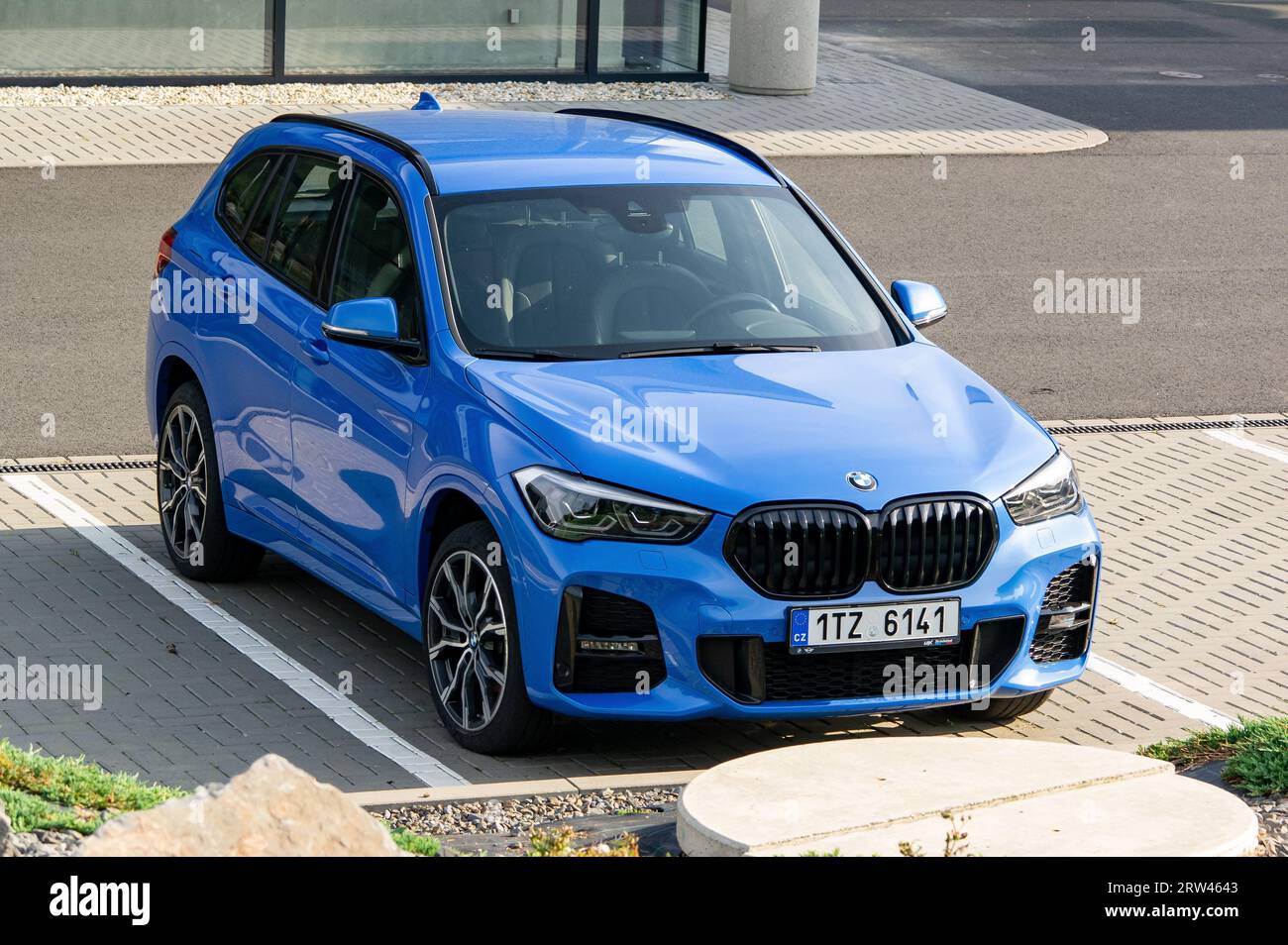 OSTRAVA, CZECH REPUBLIC - JULY 14, 2023: BMW X1 M  SUV crossover with blue colour parked in front of the dealership Stock Photo