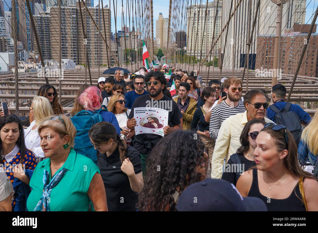 New York, USA. 16th Sep, 2023. Hundreds of people rally and march across of Brooklyn Bridge in New York on September 16, 2023 on one year anniversary of murder of Mahsa Jina Amini in Iran after arest for allegedly not wearing the hijab. (Photo by Lev Radin/Sipa USA) Credit: Sipa USA/Alamy Live News Stock Photo