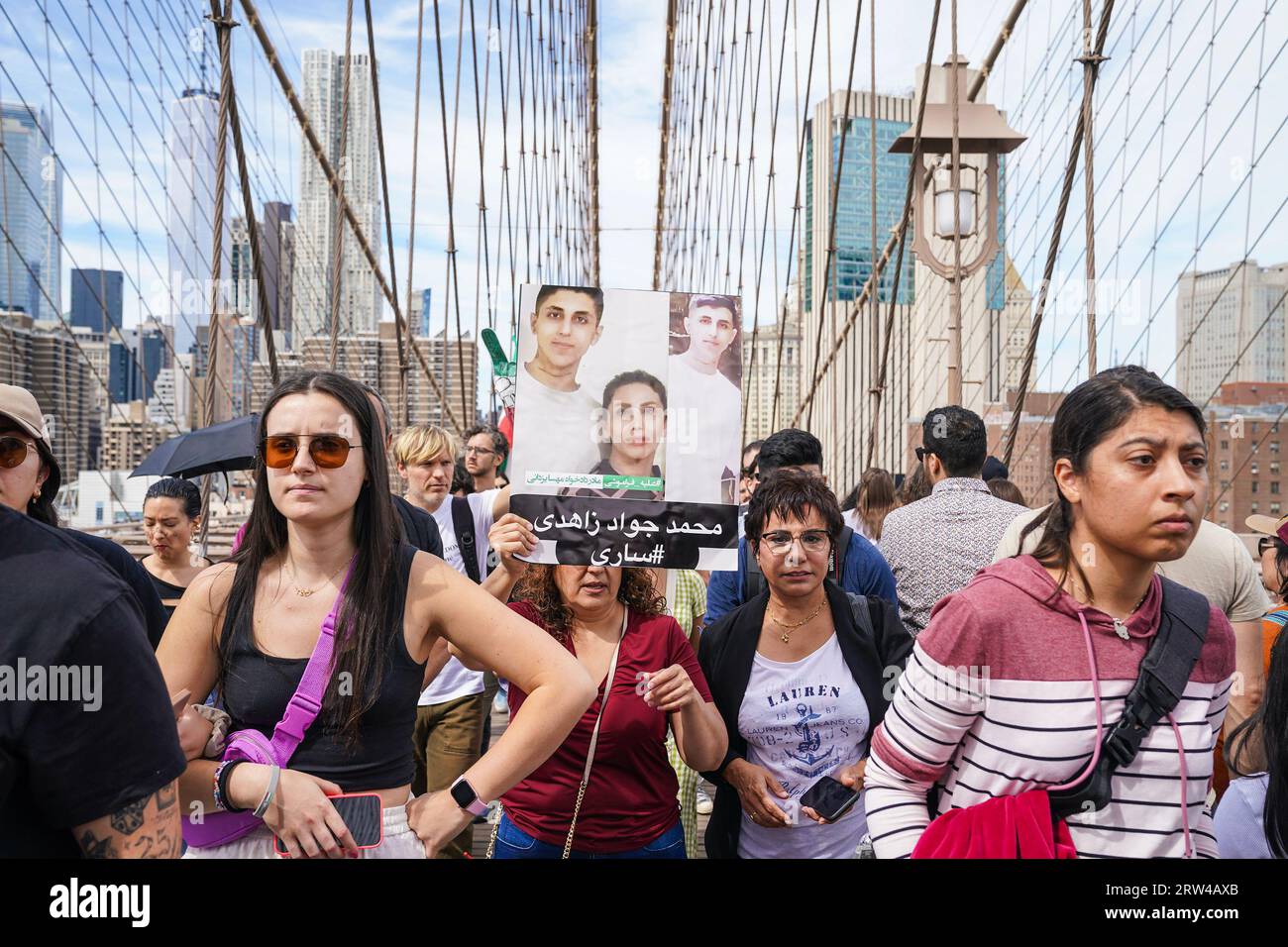 New York, USA. 16th Sep, 2023. Hundreds of people rally and march across of Brooklyn Bridge in New York on September 16, 2023 on one year anniversary of murder of Mahsa Jina Amini in Iran after arest for allegedly not wearing the hijab. (Photo by Lev Radin/Sipa USA) Credit: Sipa USA/Alamy Live News Stock Photo