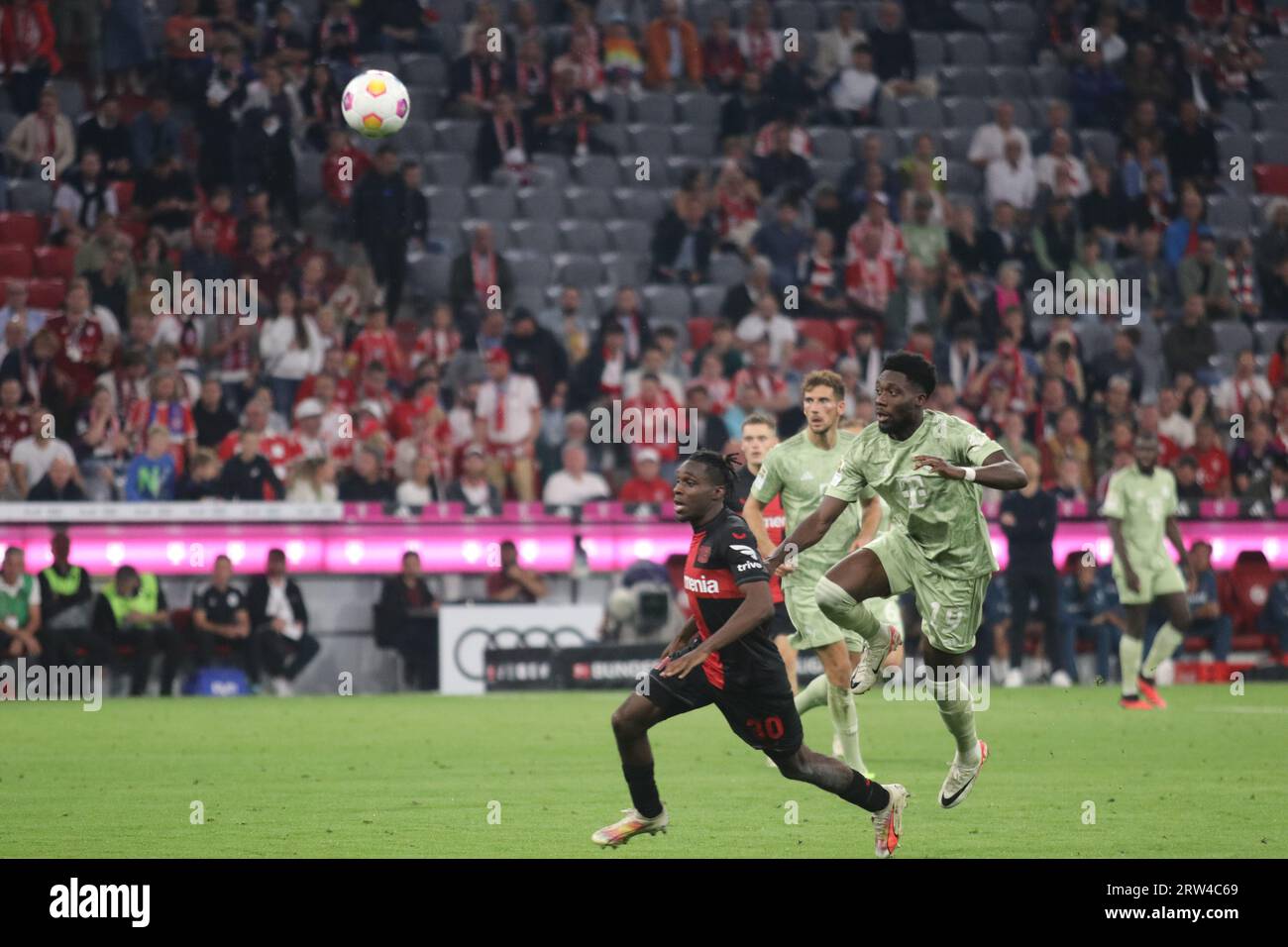 Jeremie FRIMPONG (Bayer 04 Leverkusen, #30) in a duel with Jakub KAMINSKI  (VfL Wolfsburg, #16), Stock Photo, Picture And Rights Managed Image. Pic.  PAH-321123917