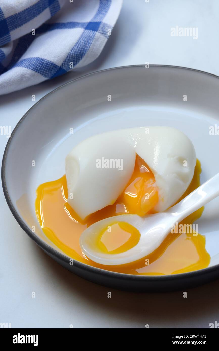 Soft boiled egg with spoon Stock Photo - Alamy
