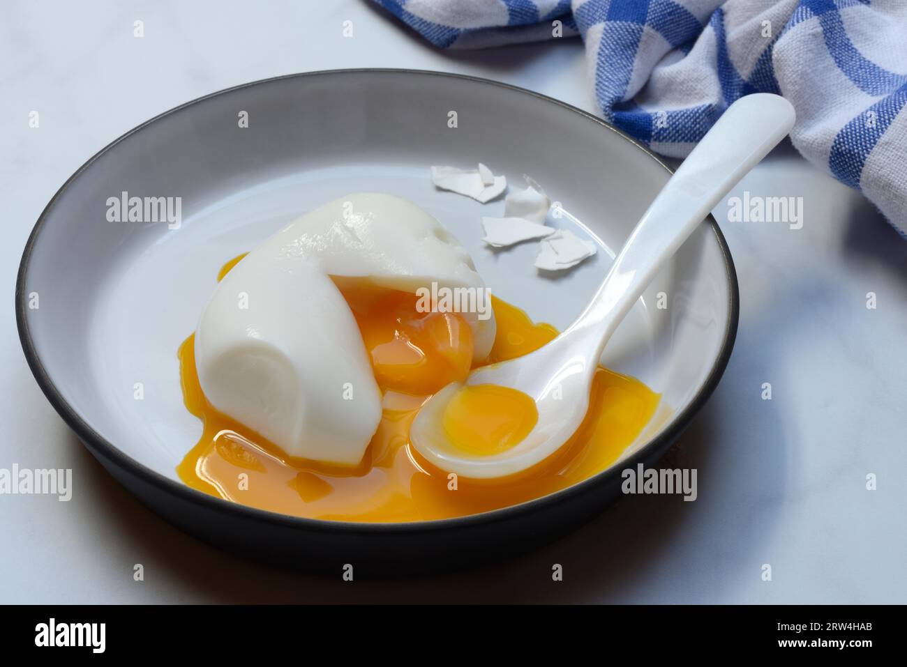 Soft boiled egg with spoon Stock Photo