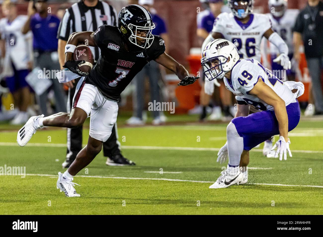 Troy wide receiver Devonte Ross (7) runs by James Madison safety Francis  Meehan (49) during the