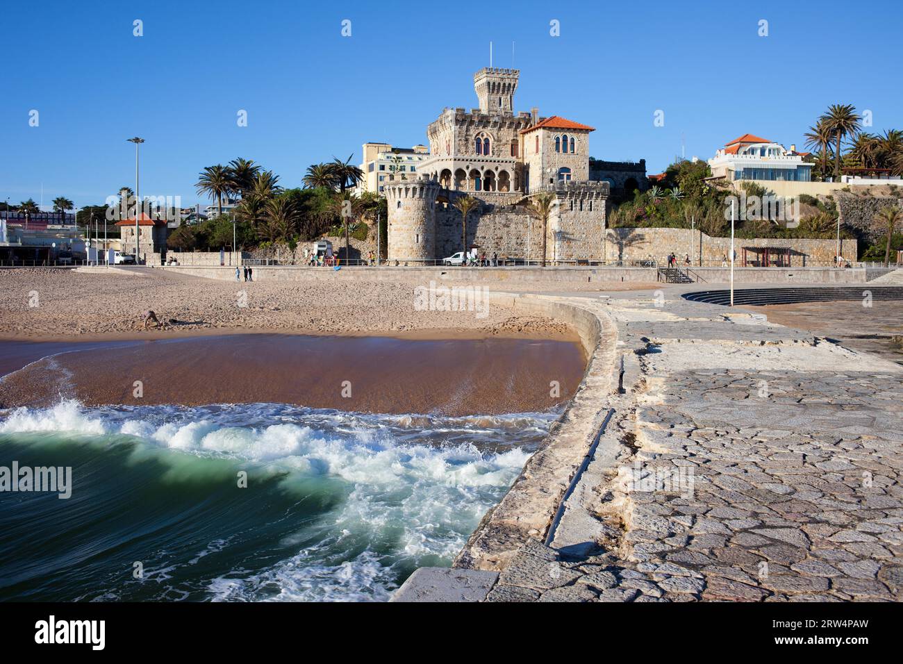 Picturesque resort town of Estoril in Portugal, castle, pier and sandy beach by the Atlantic Ocean Stock Photo