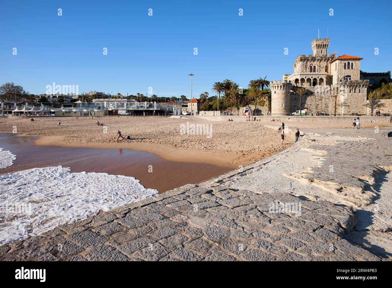 Resort town of Estoril in Portugal, castle, pier and sandy beach by the Atlantic Ocean Stock Photo