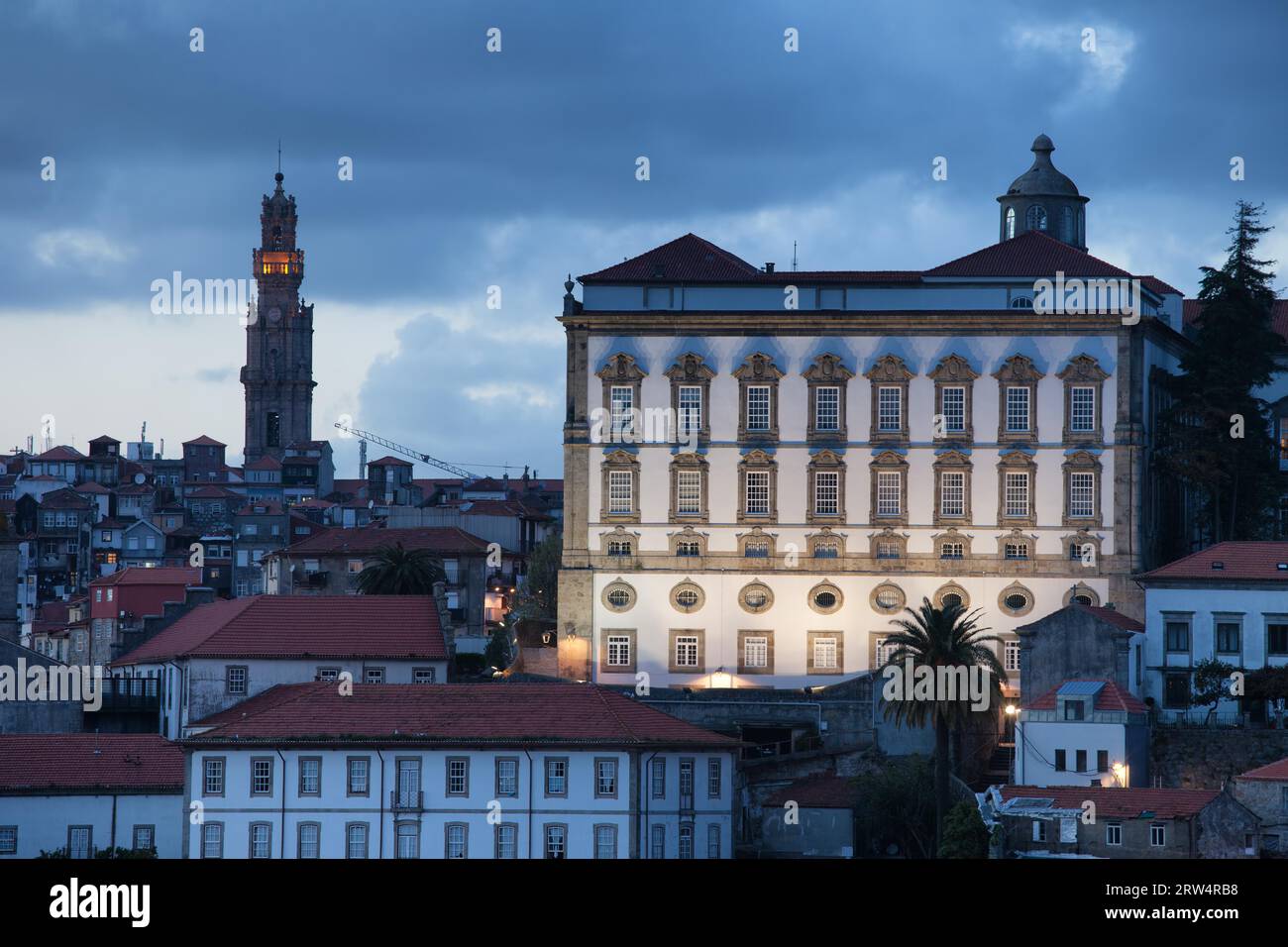 Episcopal Palace and Clerigos Church bell tower at dusk in Porto, Portugal Stock Photo
