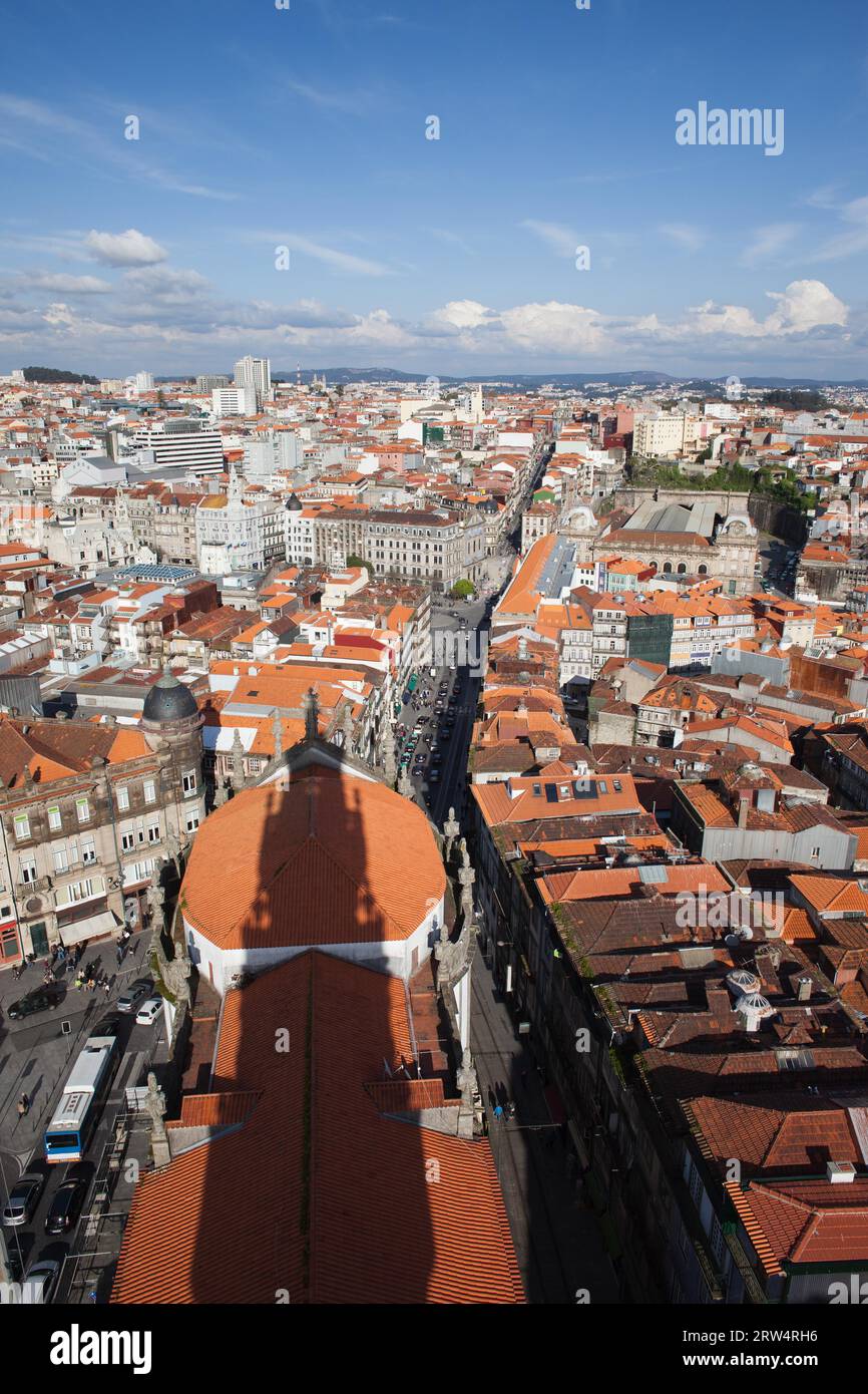 Cityscape of Porto in Portugal, view from above, shadow of Clerigos Church Tower on rooftop Stock Photo