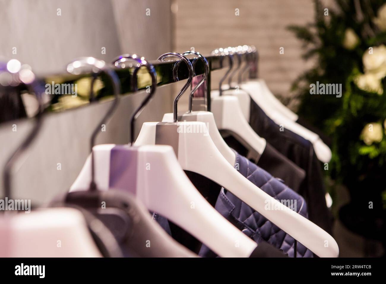 Clothes hang on a shelf in a designer clothes store in Melbourne