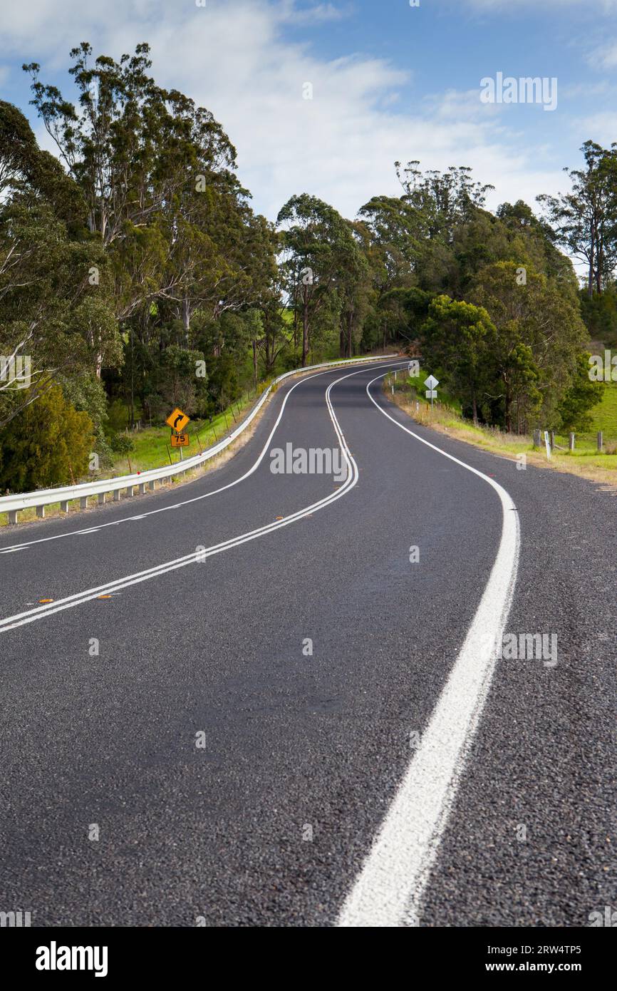 The Princes Highway winds around the countryside near Bega in New South Wales, Australia Stock Photo