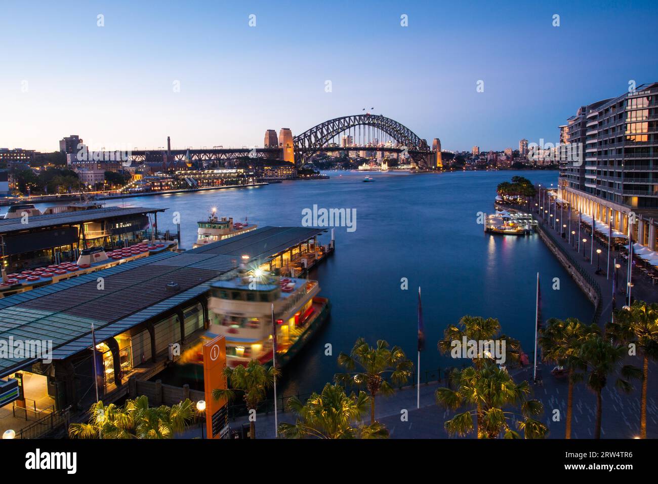 Boat traffic around Circular Quay at rush hour on a winter's evening in Sydney, Australia Stock Photo