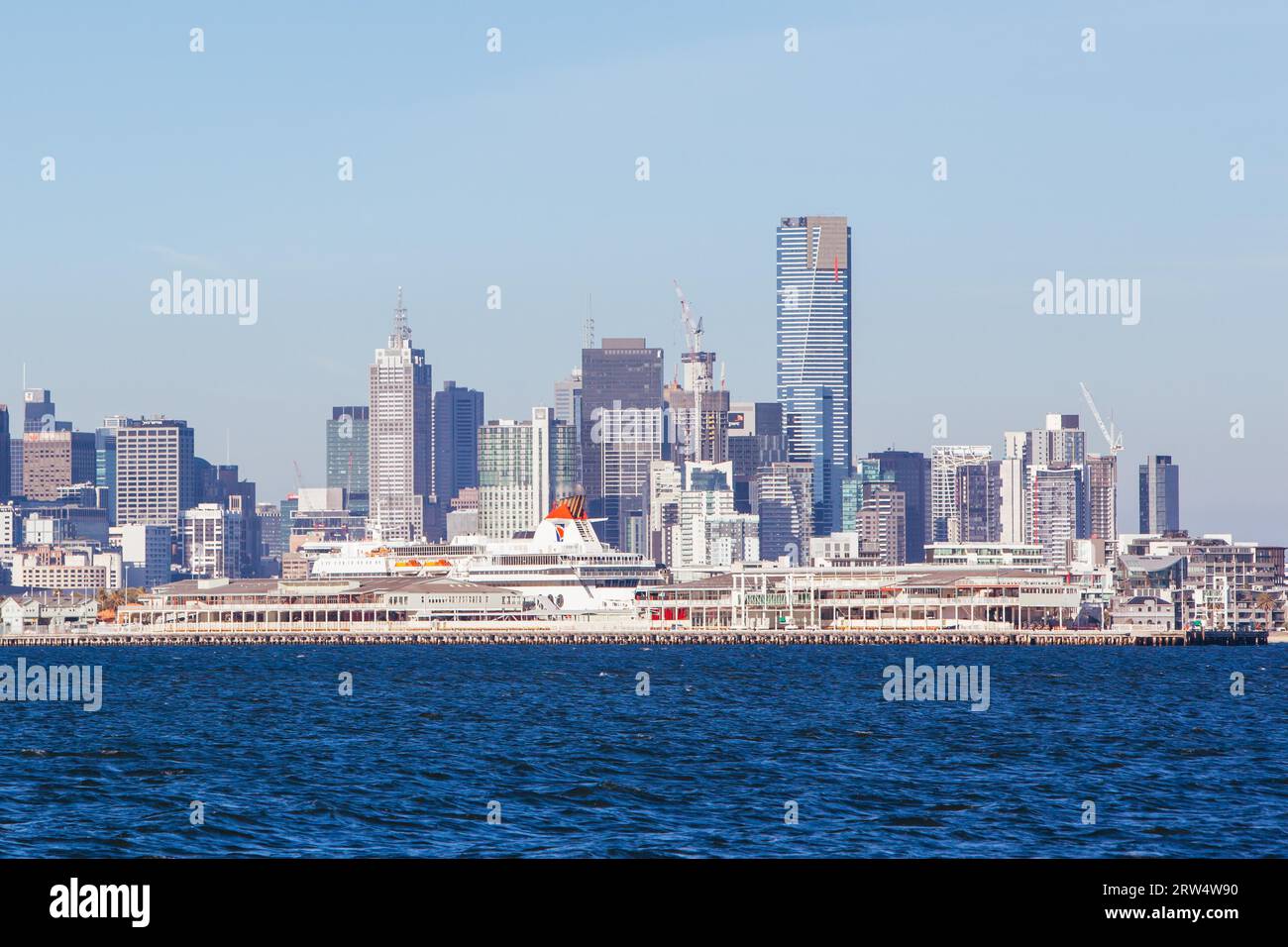 Melbourne skyline with Station Pier and the Spirit of Tasmania boat in dock on a summer's day from Port Phillip Bay Stock Photo