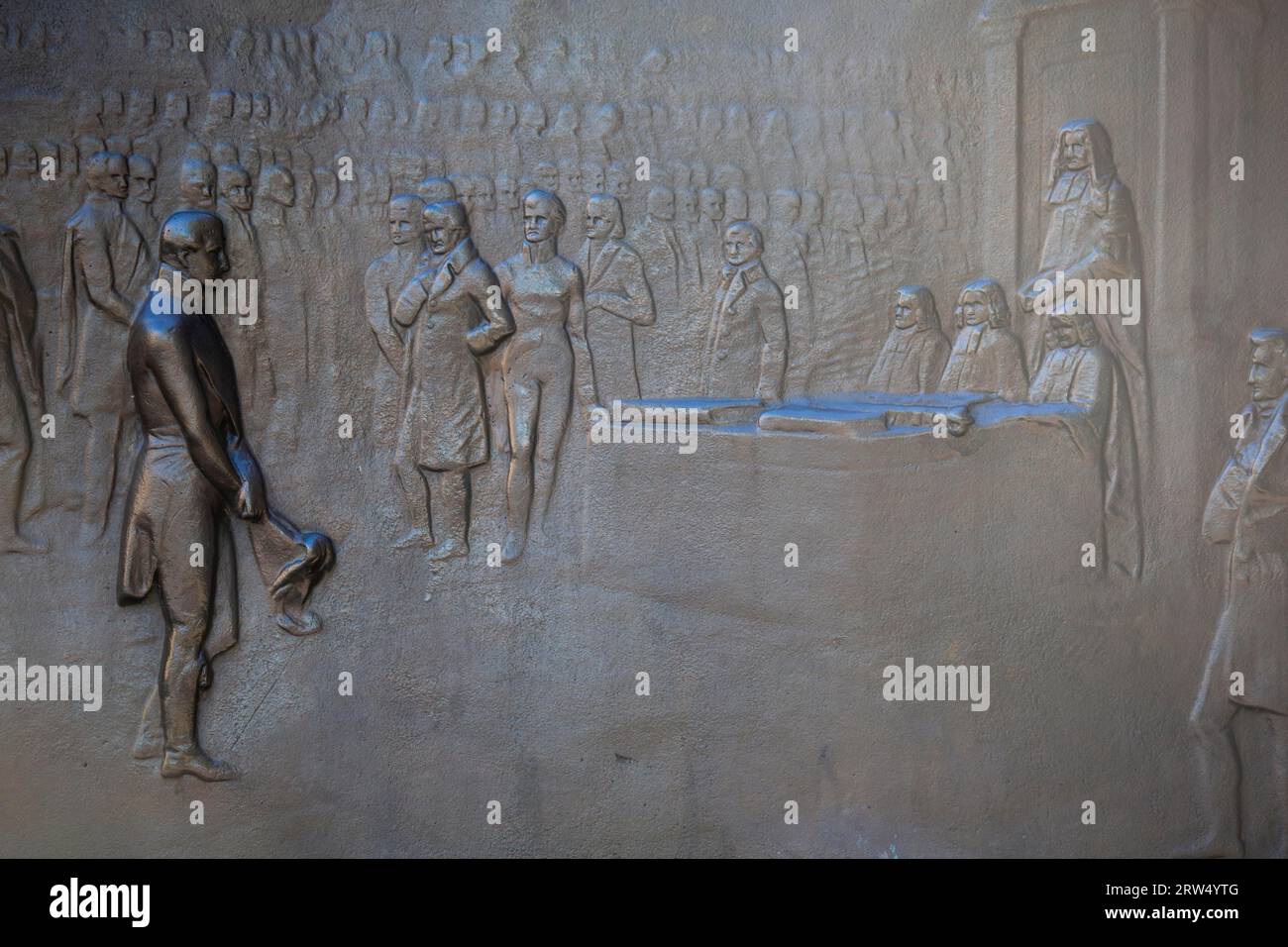 An engraving on the Wellington Monument shows The Duke of Wellington receiving gratitude before the House of Commons in 1814. Picadilly, Manchester Stock Photo