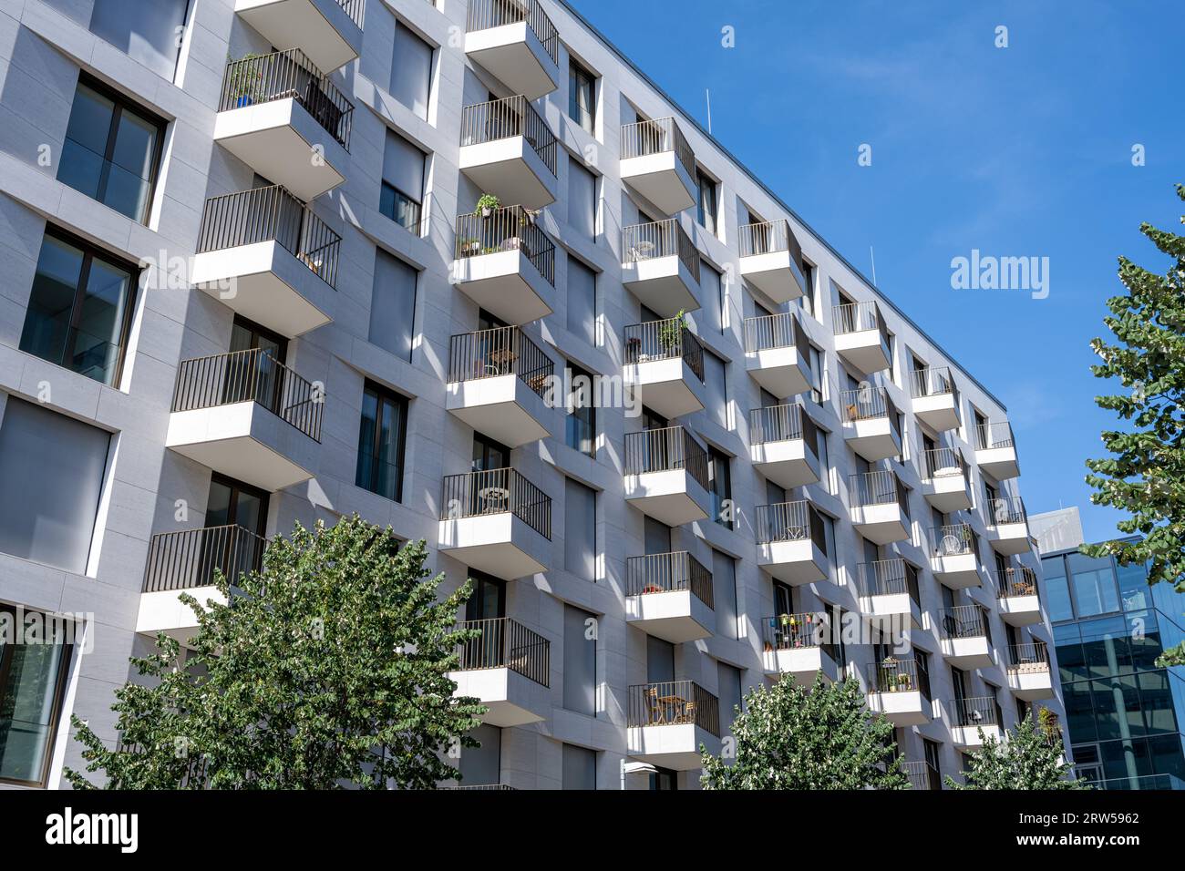 White apartment building with many small balconies seen in Berlin, Germany Stock Photo