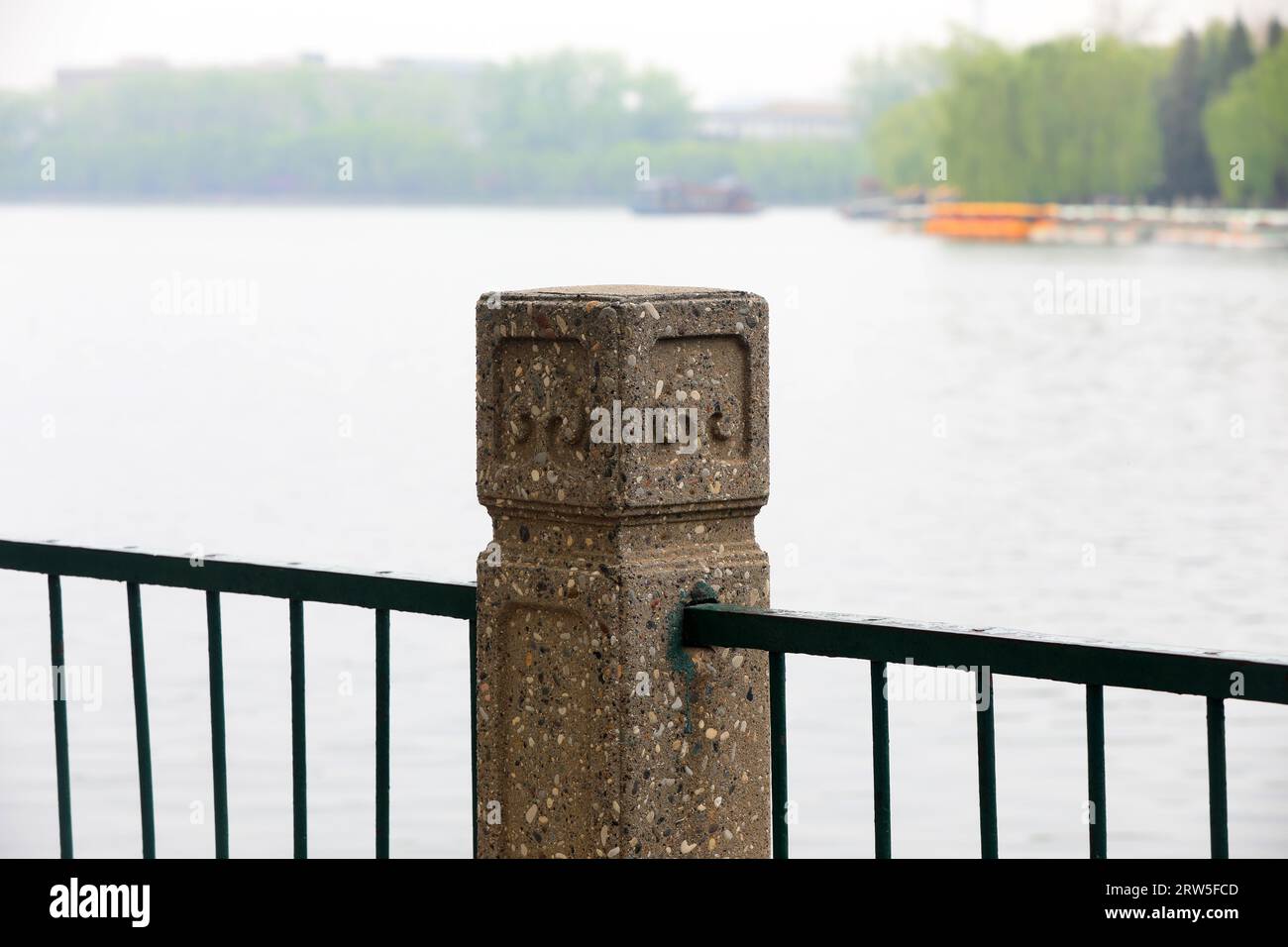 Cement railing column by the water, close-up photo Stock Photo - Alamy