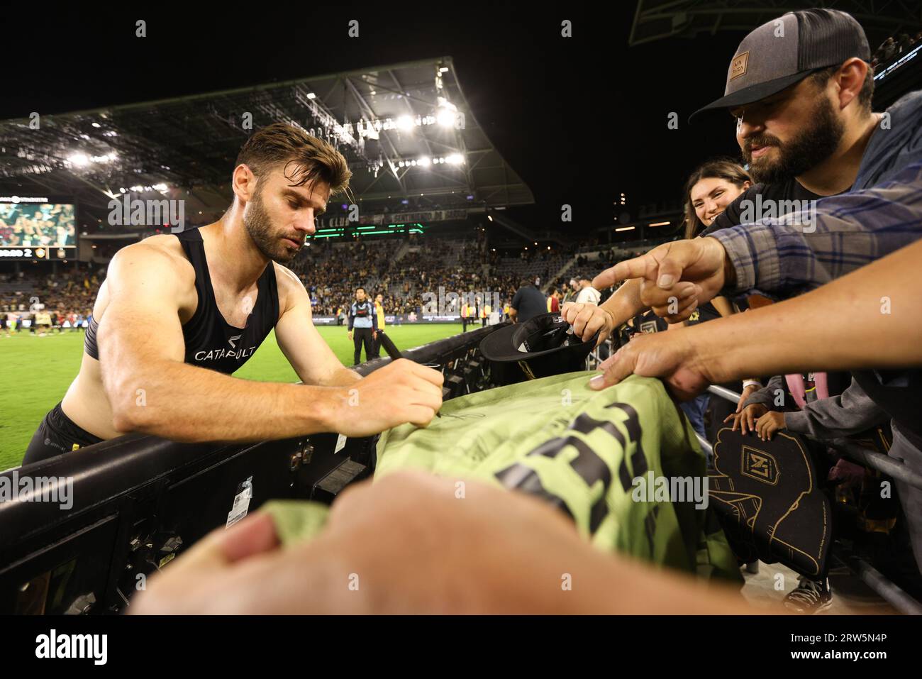 Los Angeles, California, USA. 16th Sep, 2023. Los Angeles FC forward MARIO GONZÃLEZ (9) signs a fan's jersey after a MLS soccer match between Los Angeles Galaxy and Los Angeles FC at BMO Stadium in Los Angeles, California. (Credit Image: © Brenton Tse/ZUMA Press Wire) EDITORIAL USAGE ONLY! Not for Commercial USAGE! Stock Photo