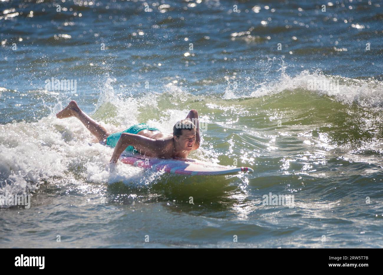 Cape May, United States. 16th Sep, 2023. Surfers attempt to ride some