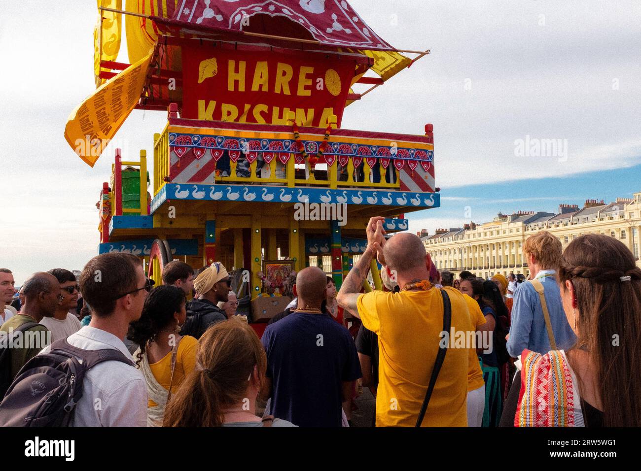 Members of Hare Krishna parade along Brighton and Hove promenade. September 2023 Stock Photo