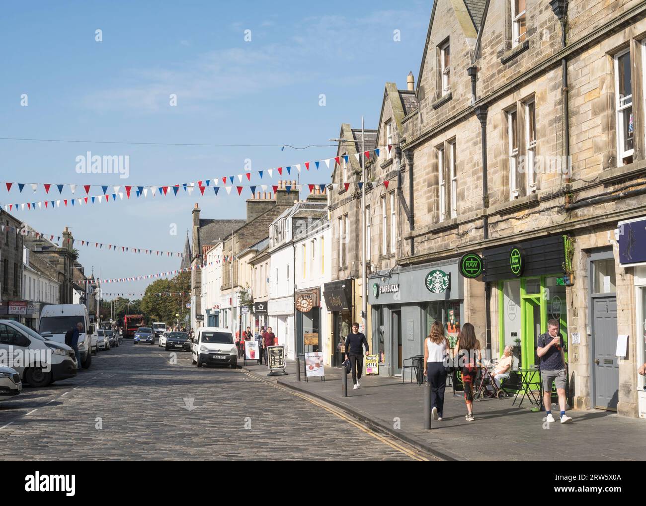 People walking along Market street in St Andrews town centre, Fife, Scotland, UK Stock Photo