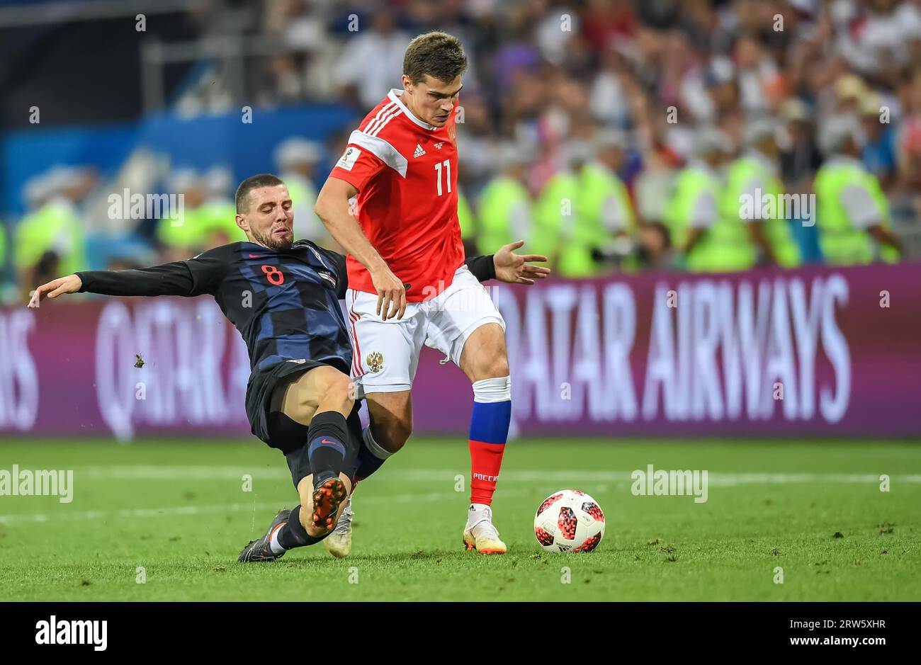 Sochi, Russia – July 7, 2018. Croatia national football team midfielder Mateo Kovacic and Russia midfielder Roman Zobnin during World Cup 2018 quarter Stock Photo