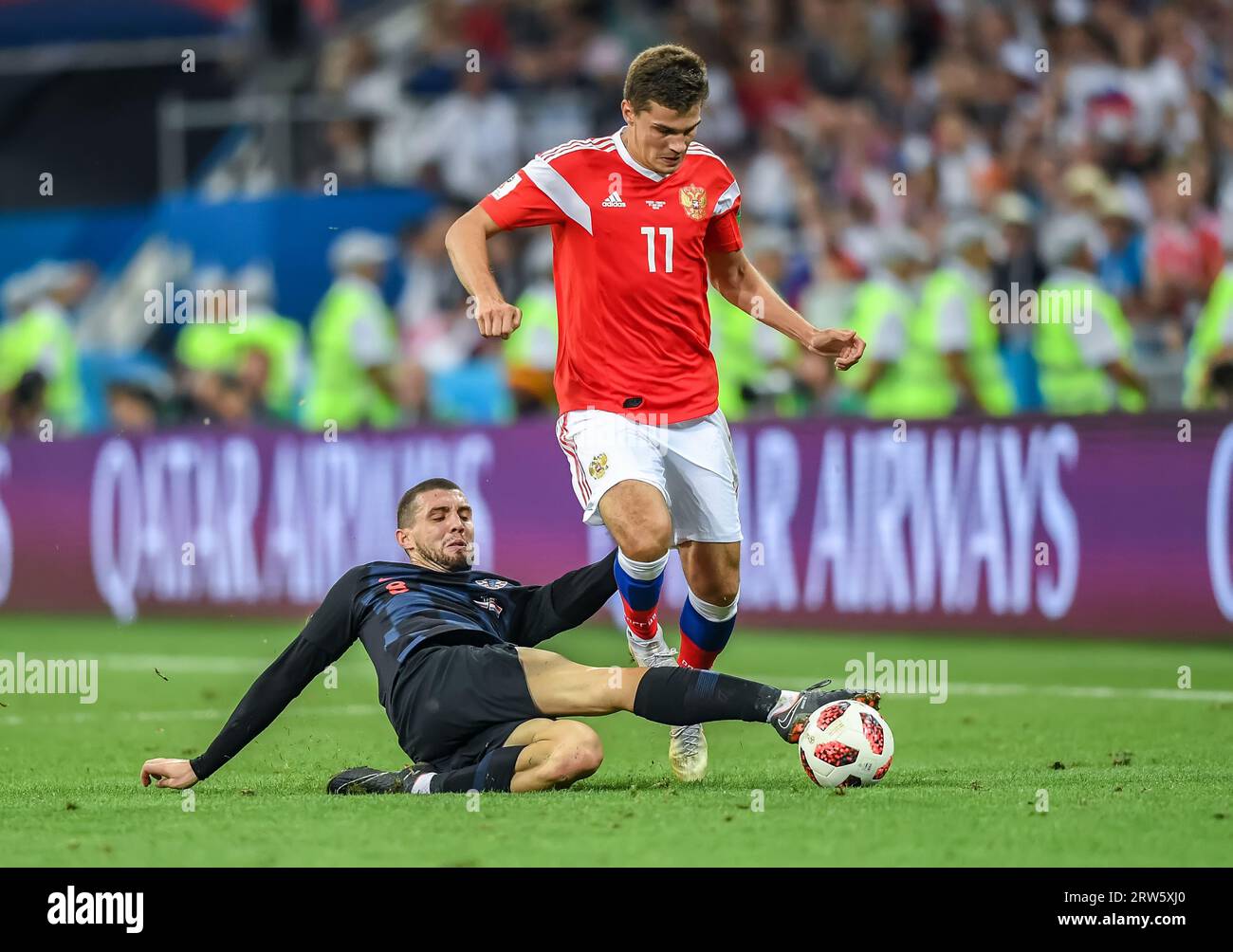 Sochi, Russia – July 7, 2018. Croatia national football team midfielder Mateo Kovacic in tackle against Russia midfielder Roman Zobnin during World Cu Stock Photo