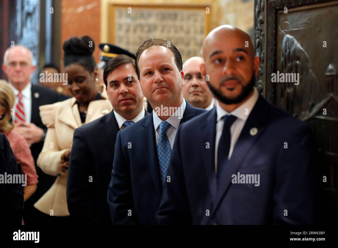 FILE - State lawmakers, right to left, Rep. Royce Duplessis, D-New Orleans,  Rep. Paul Hollis, R-Covington, Rep. Nick Muscarello, R-Hammond, and Rep.  Katrina Jackson, D-Monroe, line up to escort Louisiana Gov. John