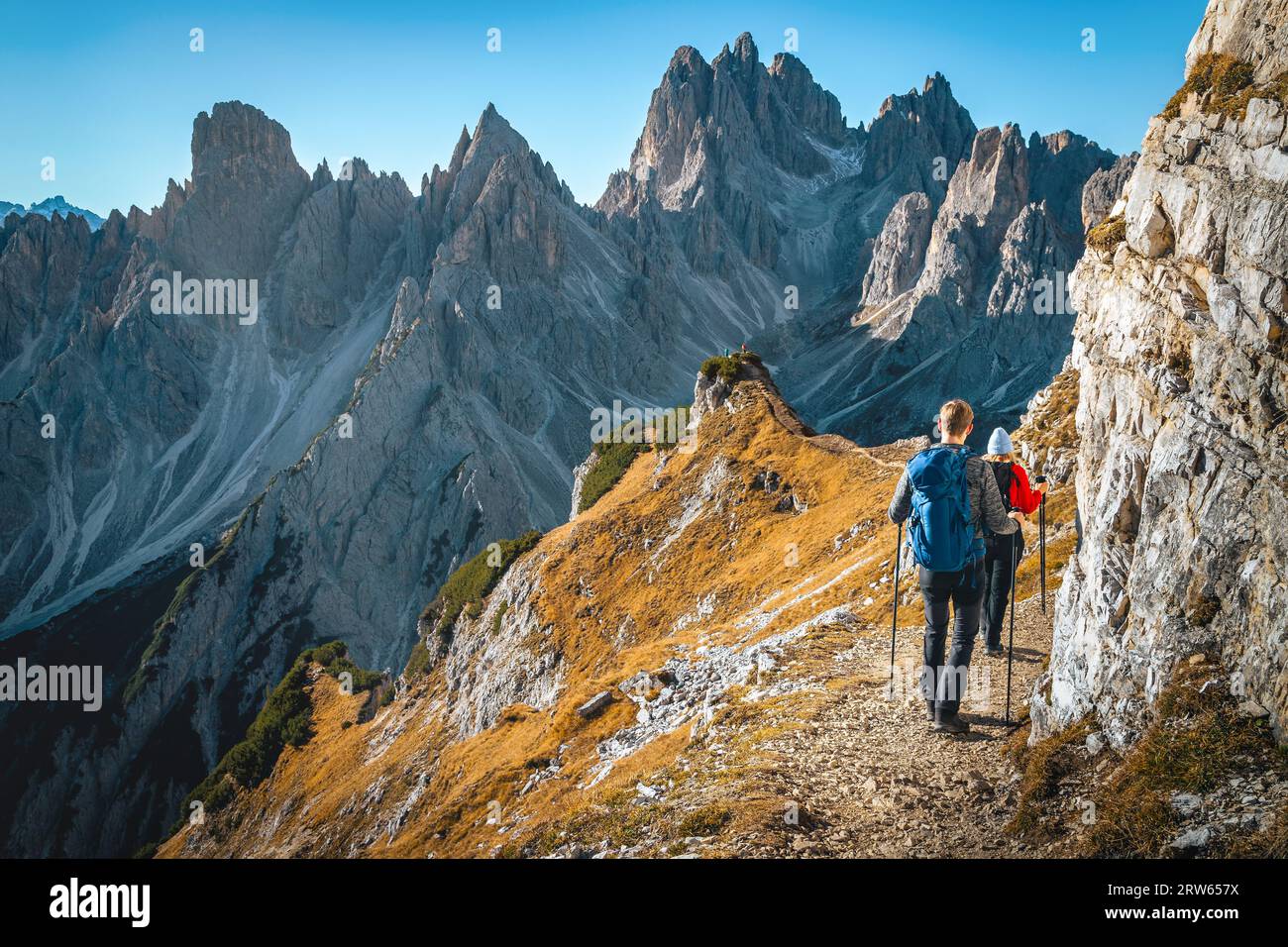Well known hiking trail with hikers in Cadini mountain group, Dolomites, Italy, Europe Stock Photo