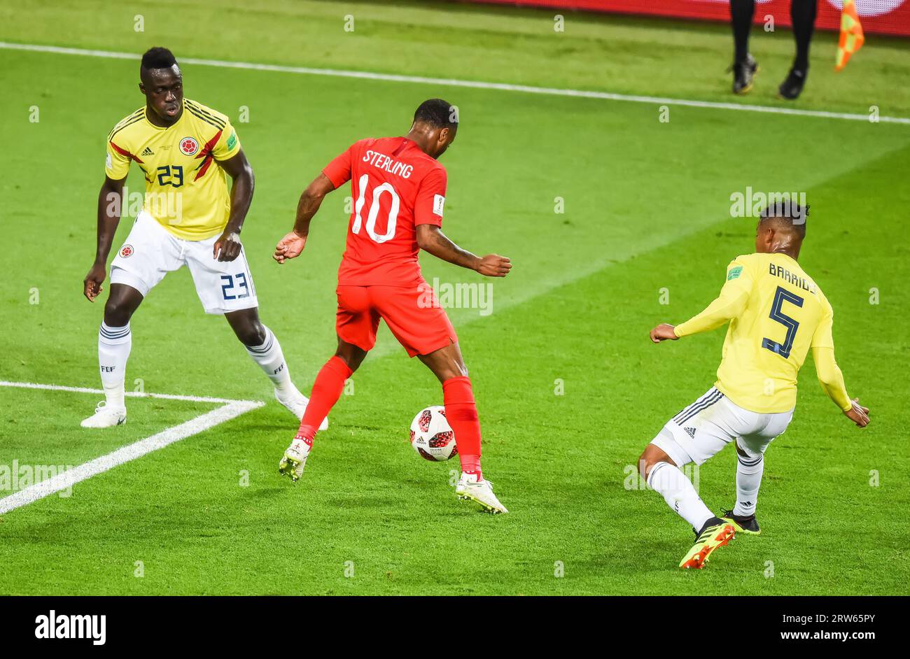 Moscow, Russia – July 3, 2018. England national football team midfielder Raheem Sterlin against Colombia players Davinson Sanchez and Wilmar Barrios d Stock Photo
