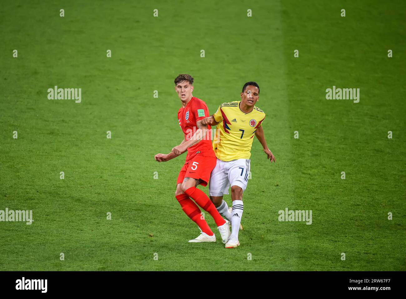 Moscow, Russia – July 3, 2018. England national football team centre-back John Stones and Colombia striker Carlos Bacca during World Cup 2018 Round of Stock Photo