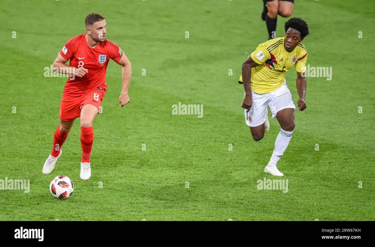 Moscow, Russia – July 3, 2018. England national football team midfielder Jordan Henderson against Colombia midfielder Carlos Sanchez during World Cup Stock Photo
