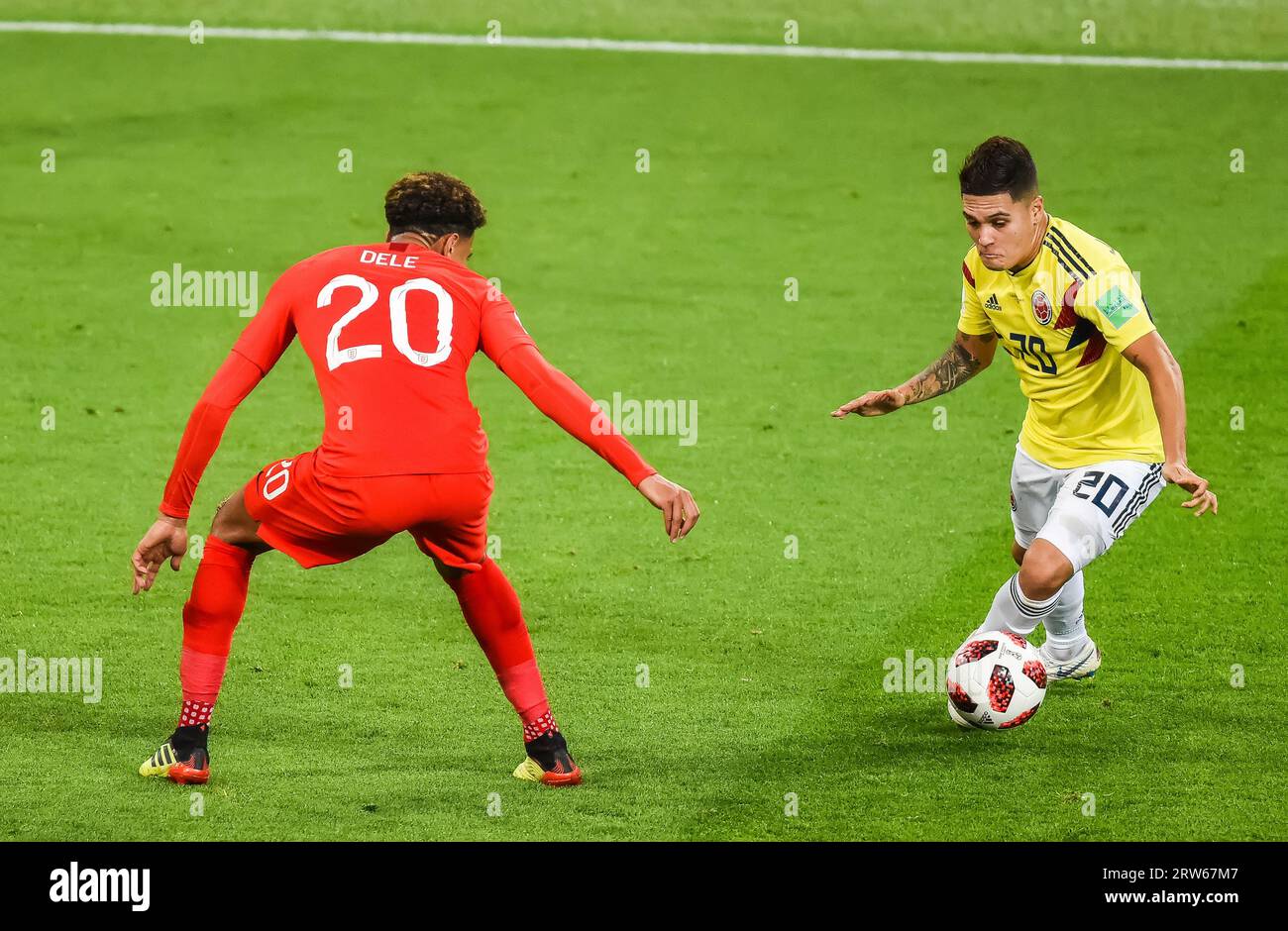 Moscow, Russia – July 3, 2018. England national football team midfielder Dele Alli against Colombia player Juan Quintero during World Cup 2018 Round o Stock Photo