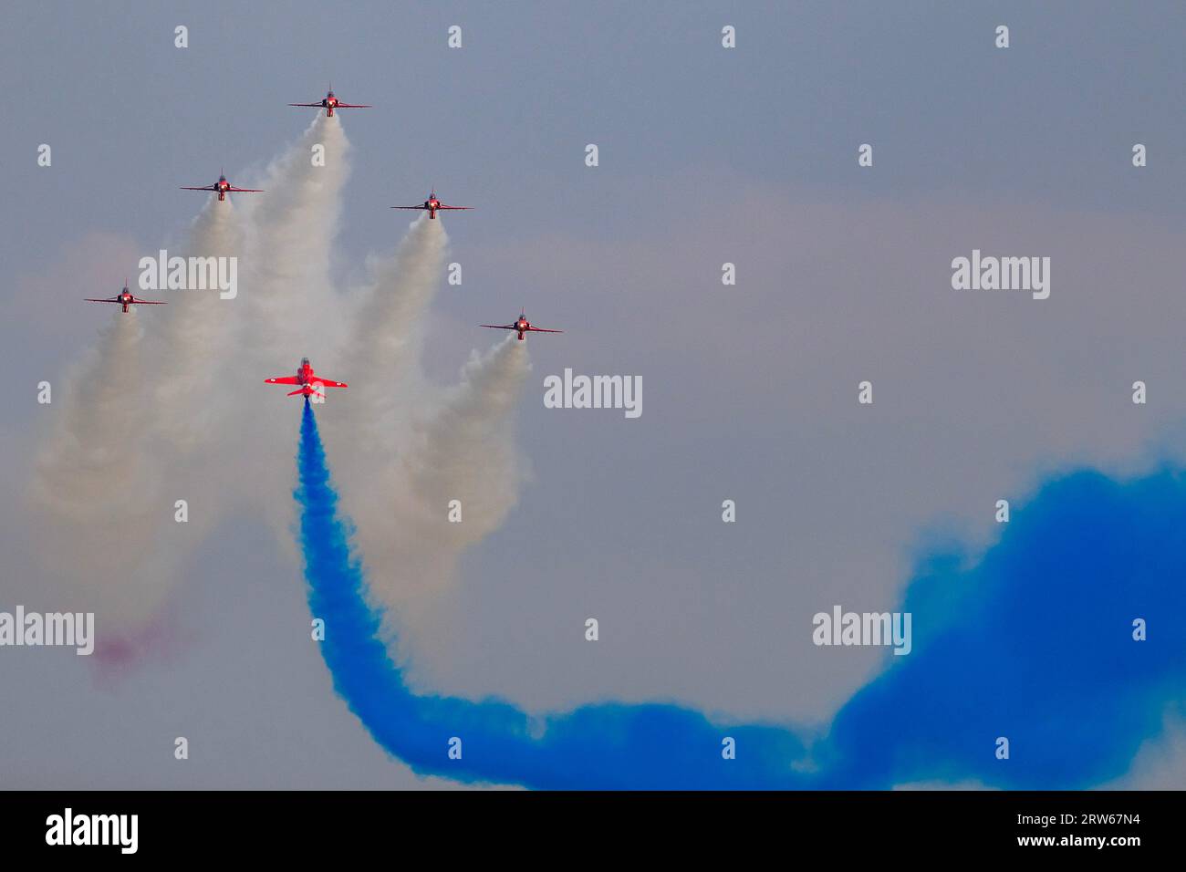 Duxford, UK. 16th Sep, 2023. The Red Arrows perform a delayed aerobatic display - The Duxford Battle of Britain Air Show at the Imperial War Museum (IWM) Duxford. The event has gone ahead with the approval of the Government after the recent death of Her Majesty the Queen Elizabeth and the official period of mourning. Credit: Guy Bell/Alamy Live News Stock Photo