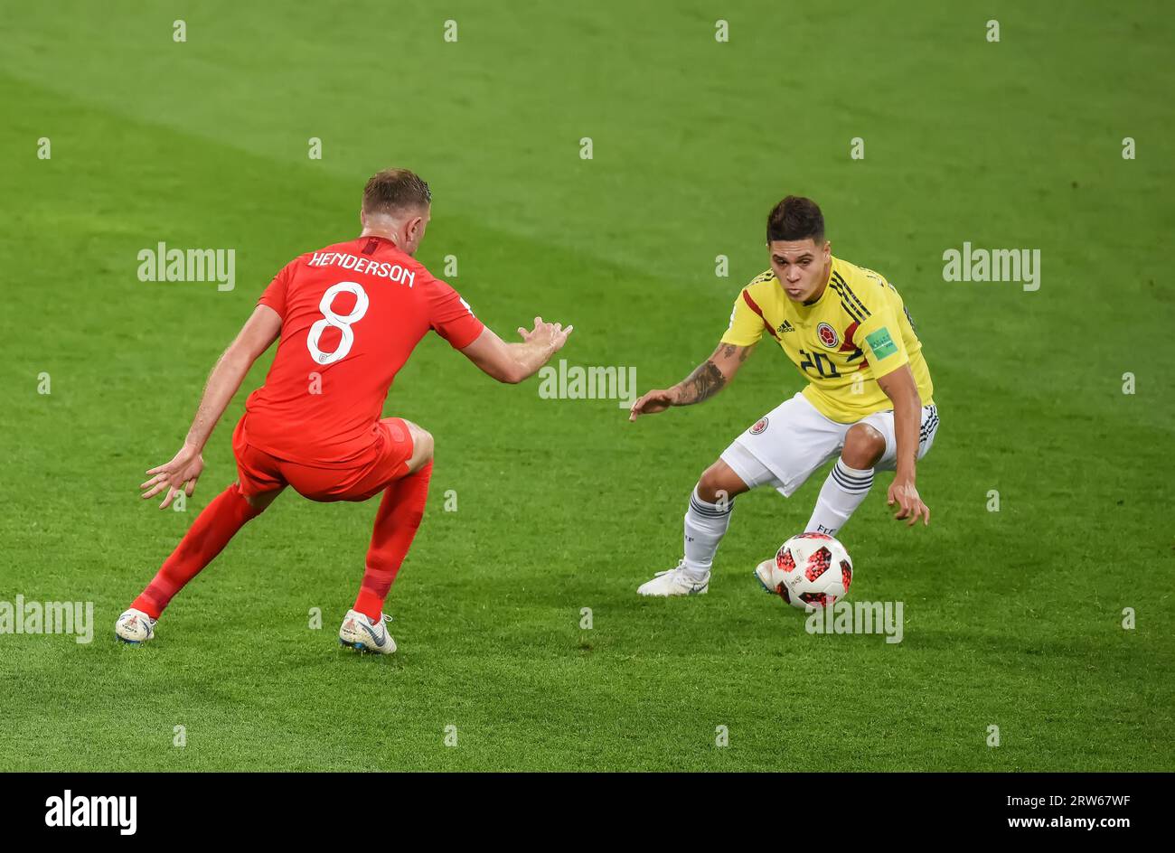 Moscow, Russia – July 3, 2018. Colombia national football team midfielder Juan Quintero and England midfielder Jordan Henderson during World Cup 2018 Stock Photo