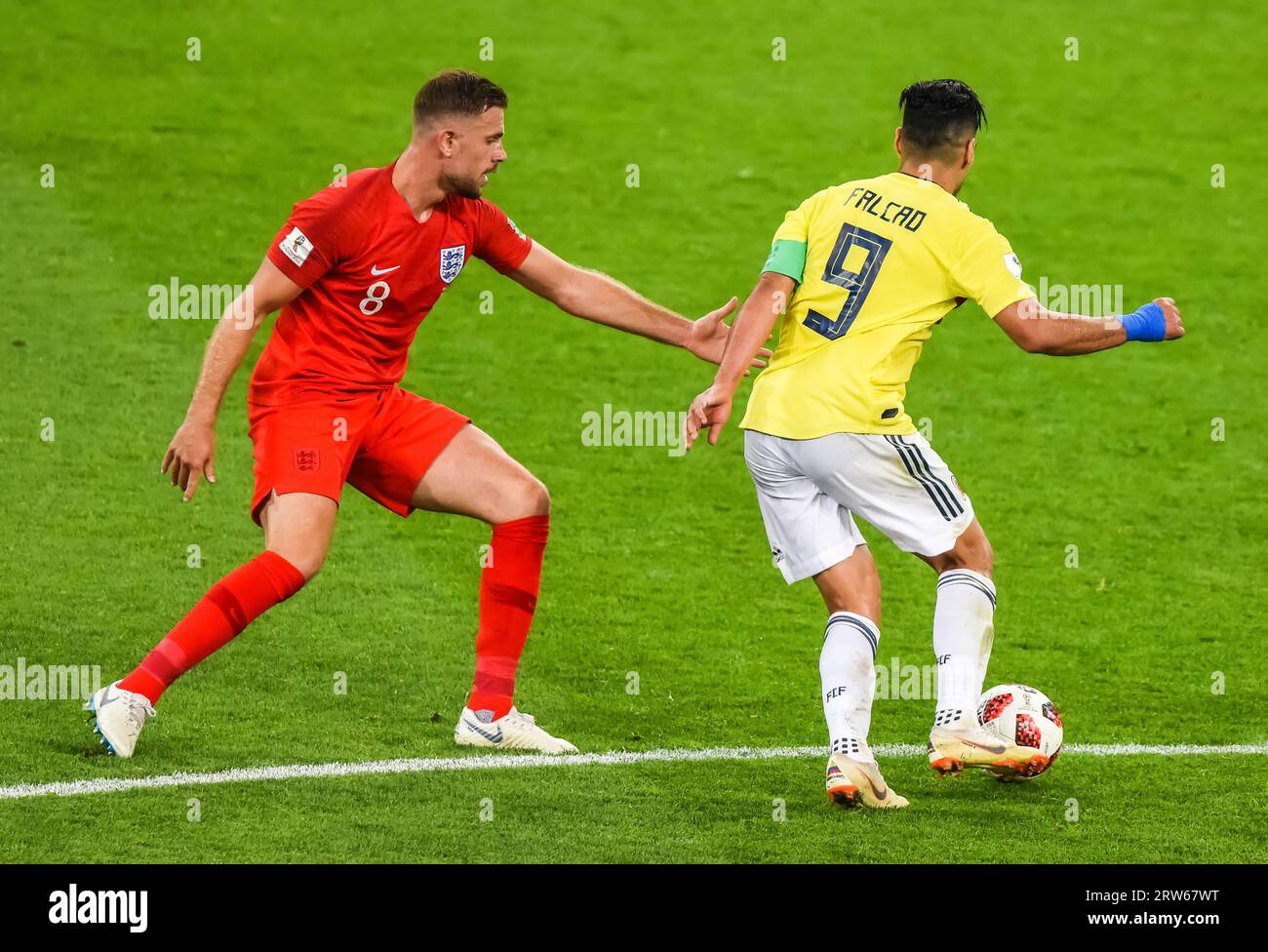 Moscow, Russia – July 3, 2018. England national football team midfielder Jordan Henderson against Colombia striker Radamel Falcao during World Cup 201 Stock Photo