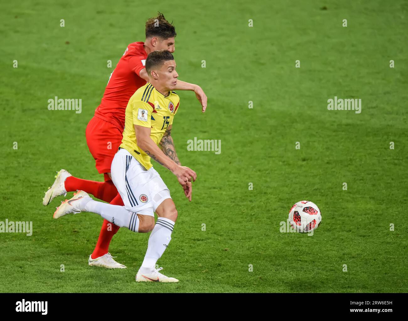 Moscow, Russia – July 3, 2018. Colombia national football team midfielder Mateus Uribe and England centre-back John Stones during World Cup 2018 Round Stock Photo