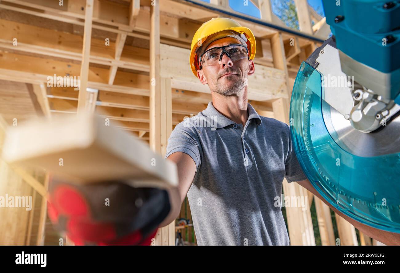 Wooden Construction Contractor Worker and His Job. Operating