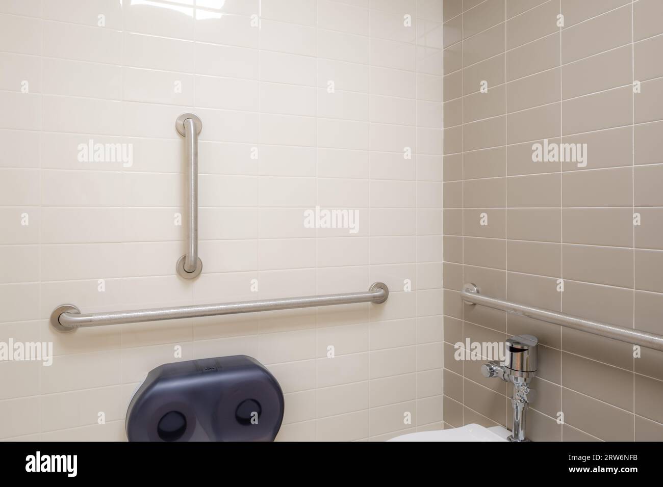 Closeup of bathroom accessible grab handles, bars, on a wall next to a