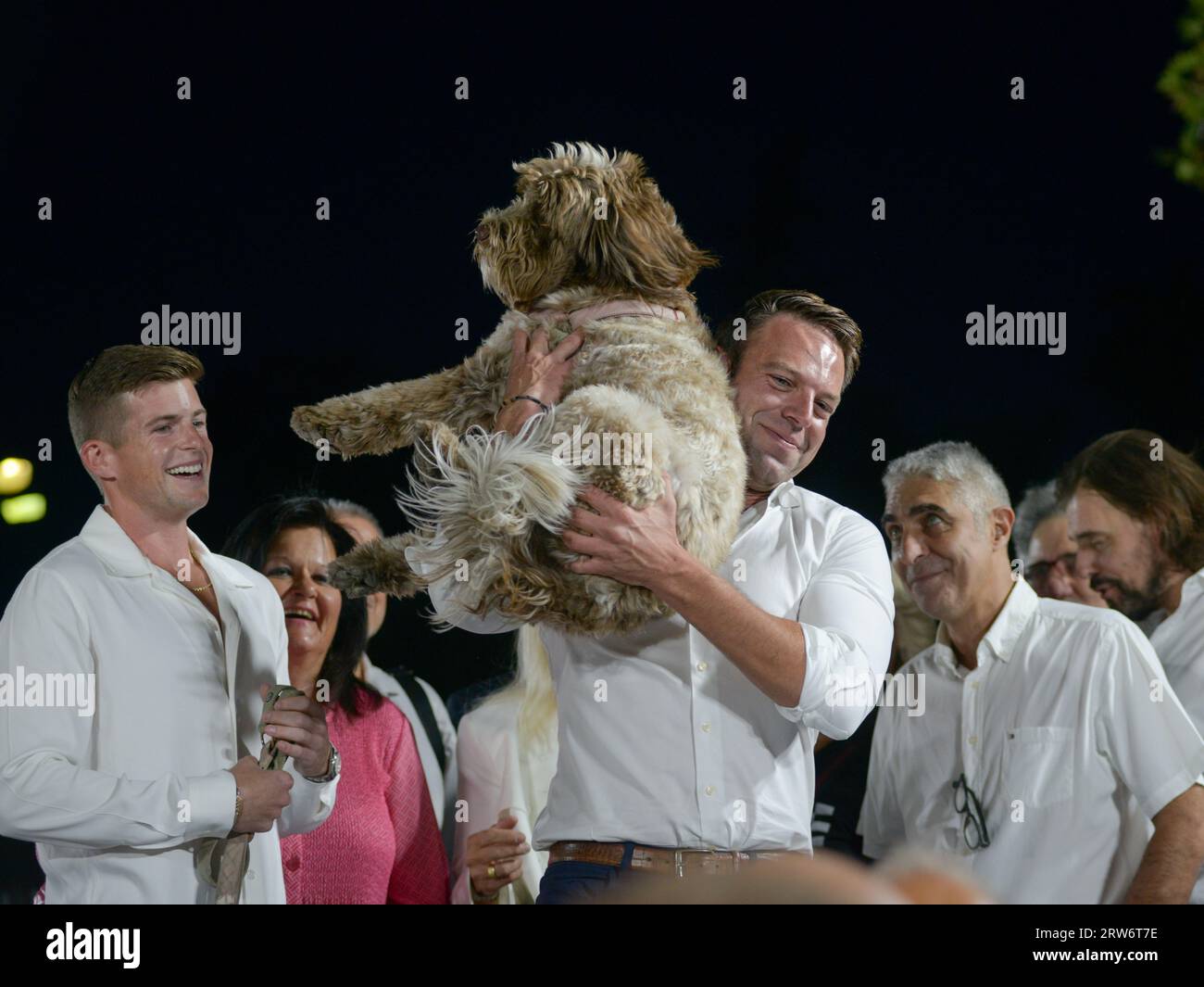 Athens, Greece - 16 September 2023. Stefanos Kasselakis (R) embraces his dog accompanied by his  husband, during his election campaign as a candidate for  the leadership of SYRIZA party. The 35-year-old self-made businessman has ignited a spectrum of reactions as he is young, attractive, affluent, self-made, of Greek descent, multilingual, openly gay, an advocate for animal rights, soon-to-be father and he also promises to bring  a new era of renewal for SYRIZA. Credit: Dimitris Aspiotis/Alamy Stock Photo