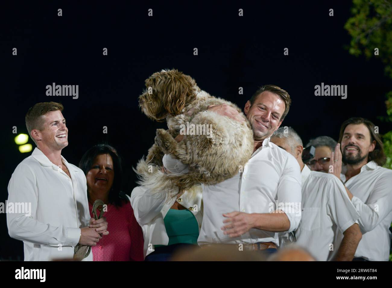 Athens, Greece - 16 September 2023. Stefanos Kasselakis (R) embraces his dog accompanied by his  husband, during his election campaign as a candidate for  the leadership of SYRIZA party. The 35-year-old self-made businessman has ignited a spectrum of reactions as he is young, attractive, affluent, self-made, of Greek descent, multilingual, openly gay, an advocate for animal rights, soon-to-be father and he also promises to bring  a new era of renewal for SYRIZA. Credit: Dimitris Aspiotis/Alamy Stock Photo