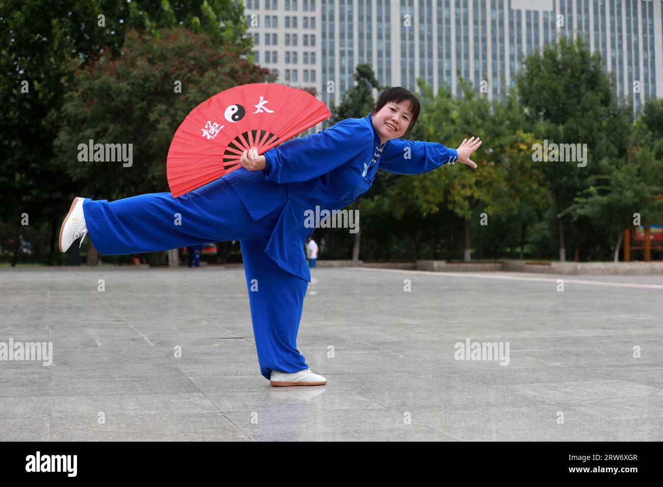 LUANNAN COUNTY, China - September 12, 2021: a woman practices Tai Chi Kung fu fan, North China Stock Photo